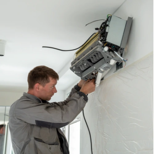 Experienced technician servicing a Haier air conditioner